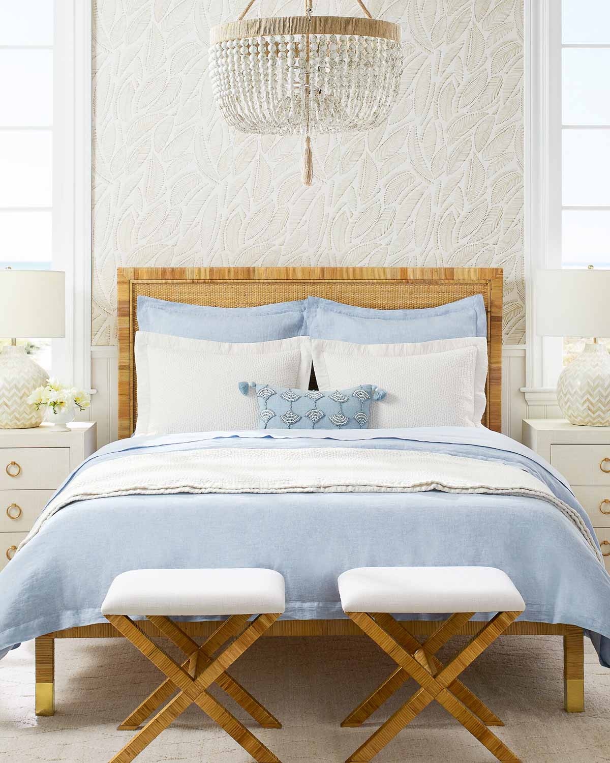 Queen bed with pair of x-base stools at the foot