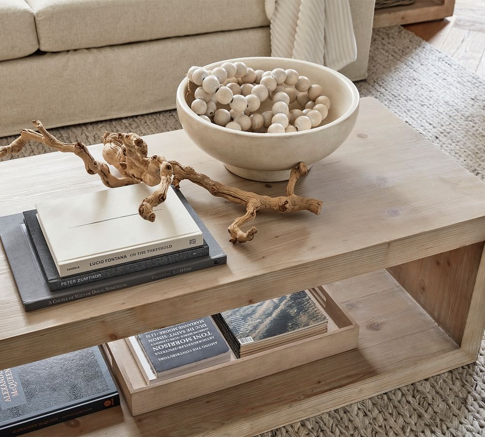 Driftwood used for decorating coffee table with books and bowl
