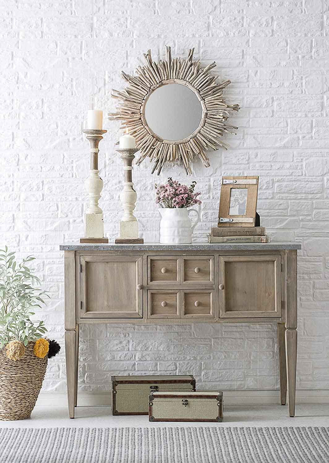 Round driftwood mirror above console