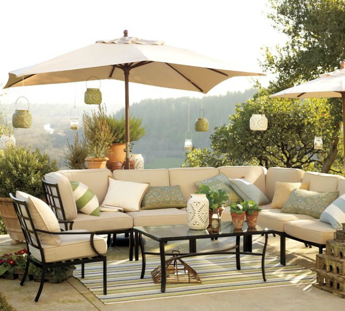 Lanterns hanging from outdoor umbrellas - perfect for entertaining!