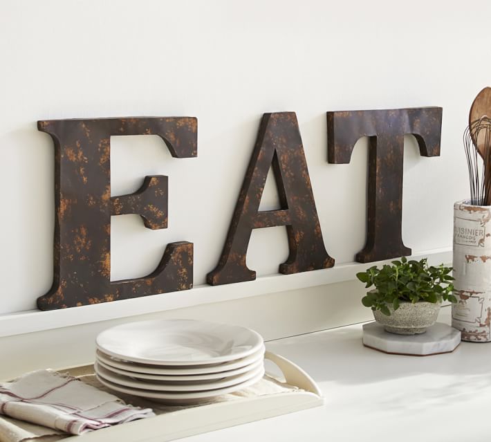 Love these large decorative letters spelling "EAT" in the kitchen!