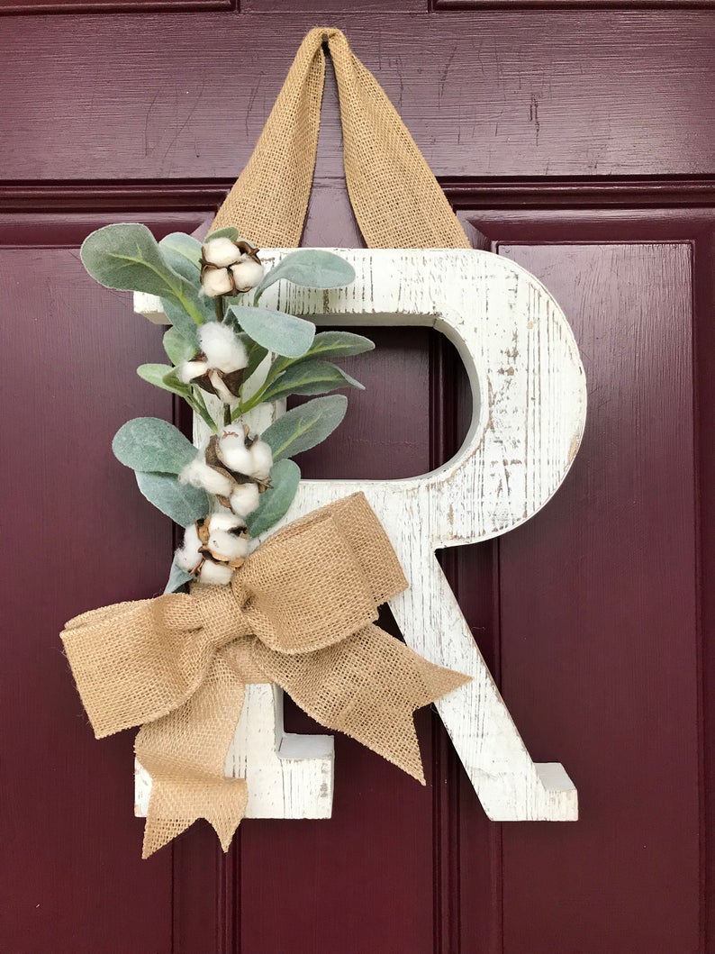 Love this whitewashed wood letter used as a front door decoration!