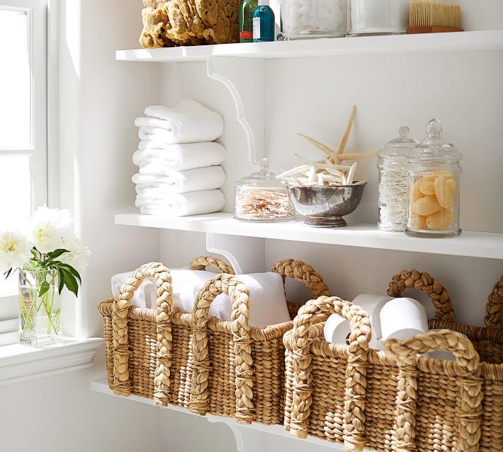 Handled seagrass baskets for bathroom storage (these are filled with TP)