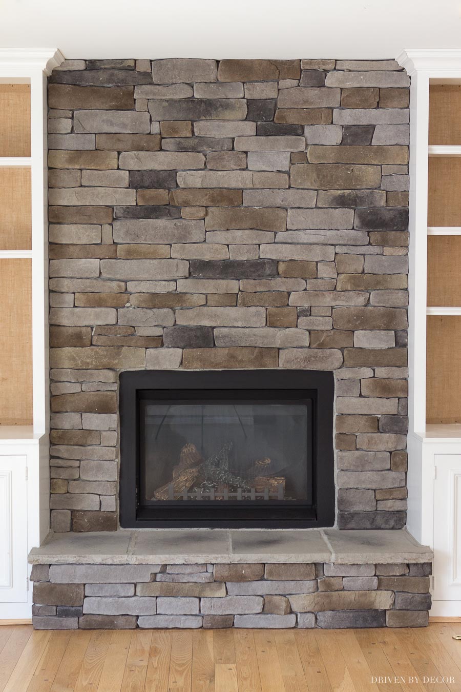 Loving this ledgestone / stacked stone fireplace! Such a transformation from the brick fireplace "before"