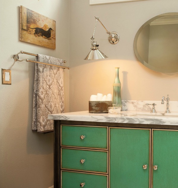 Swing arm sconce used in a bathroom