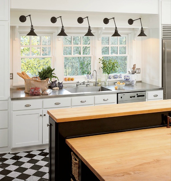 Swing arm sconces in the kitchen - love this look!