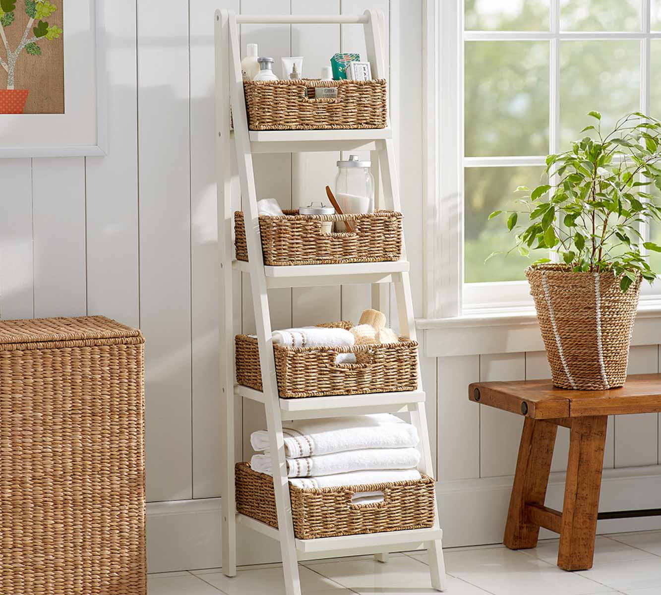 Decorative ladder with storage baskets sitting on shelves