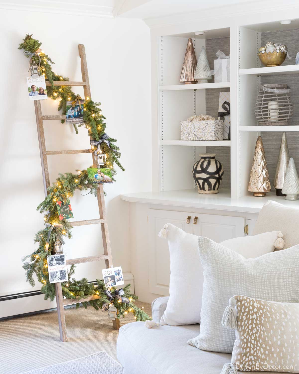 Decorative ladder with garland, mini lanterns, and lights for Christmas