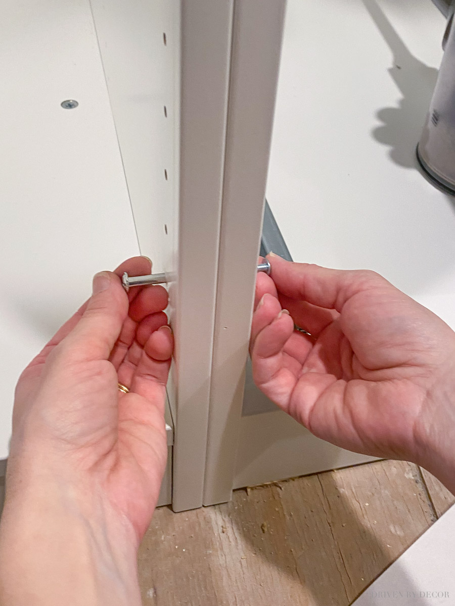 Attaching IKEA wardrobe frames with binding screws when installing an IKEA PAX closet