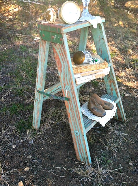 A short vintage step ladder makes a great unique nightstand!