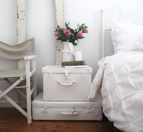 Paint a pair of old suitcases and stack them to create a unique nightstand!