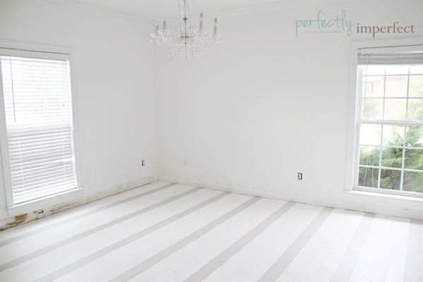 She used chalk paint to create these gorgeous subtle stripe floors!