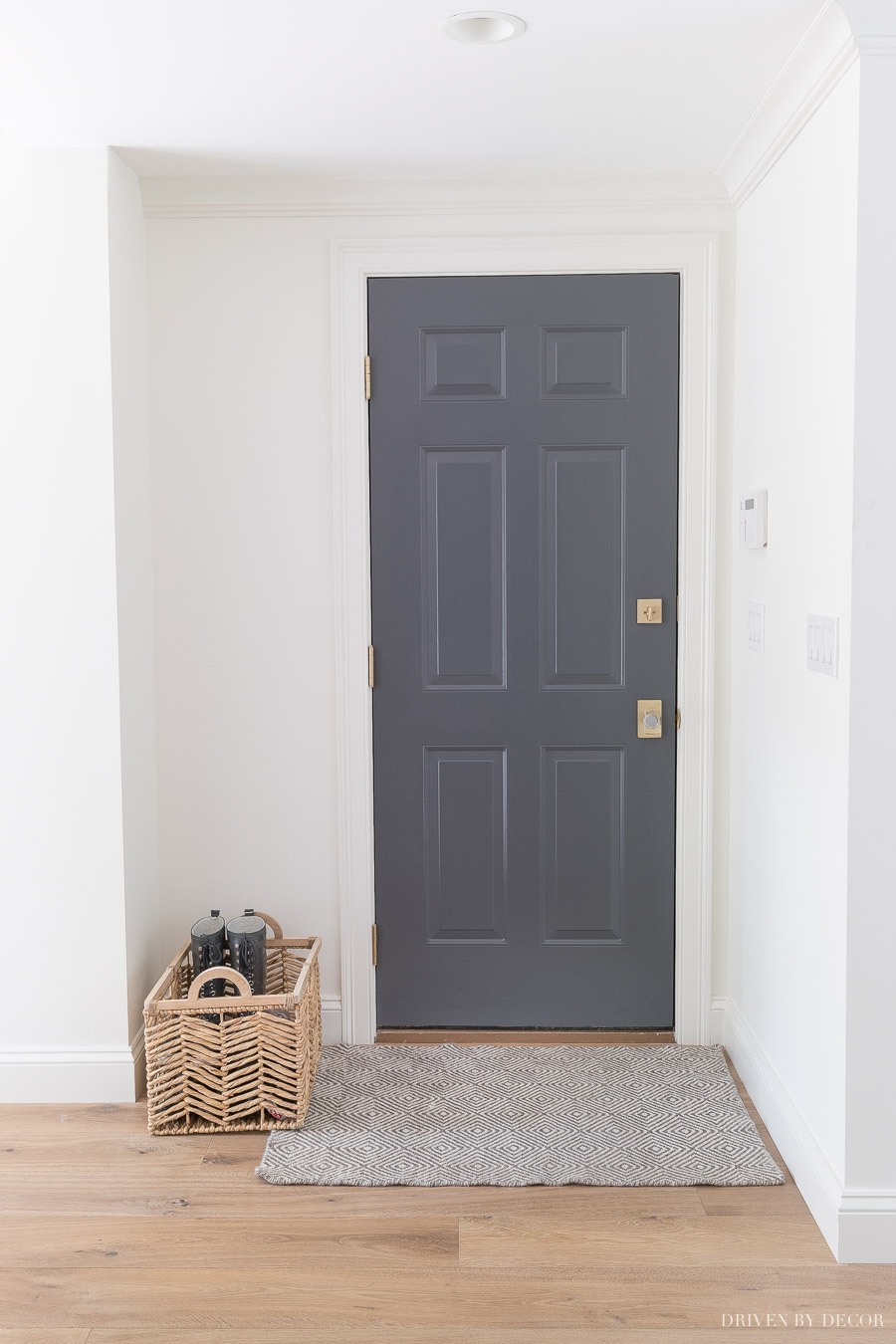 Tips for painting interior doors including choosing a paint color. Love this dark gray!