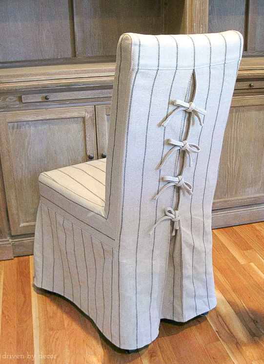 Love the corseted slipcovers on these dining chairs - the ties are so cute!