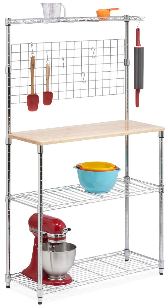 A simple chrome baker's rack with maple cutting board shelf