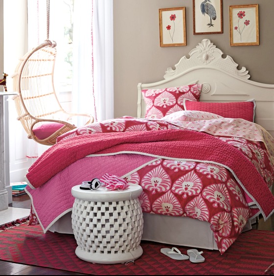 A hanging rattan chair in a girl's bedroom - so cute and fun!