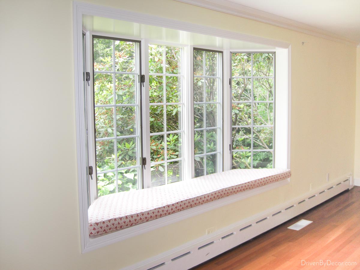 Our living room window seat before we painted and replaced the cushion