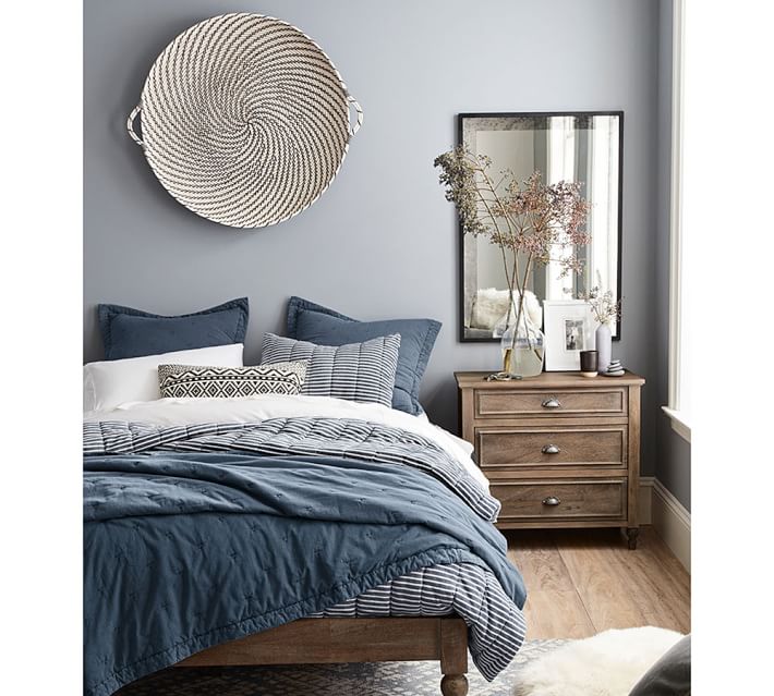 Great statement basket as wall art over a bed - love this and other ideas for above the bed decor in this post!