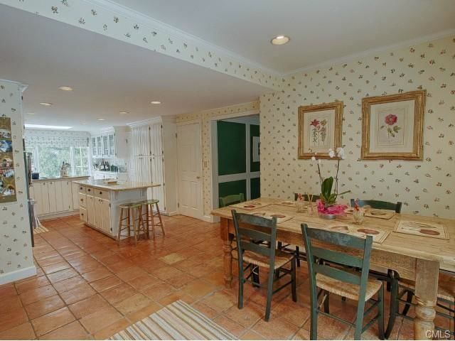 The "before" of our kitchen with dated floral wallpaper!