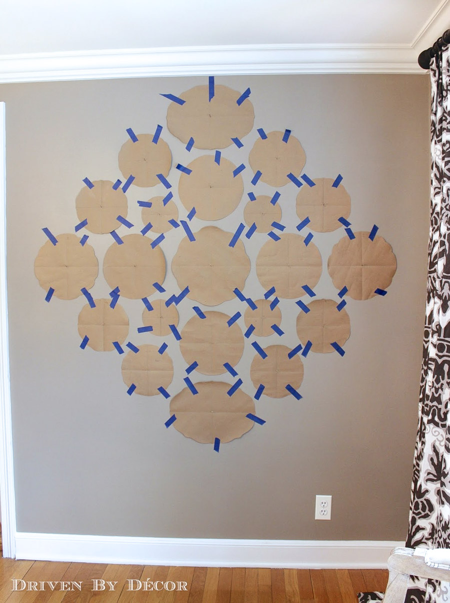 Trace each plate on paper and tape it on the wall before hanging your plates!