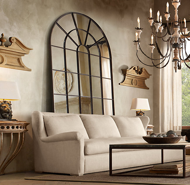 Love the look of having an oversized palladian leaner mirror behind a sofa!