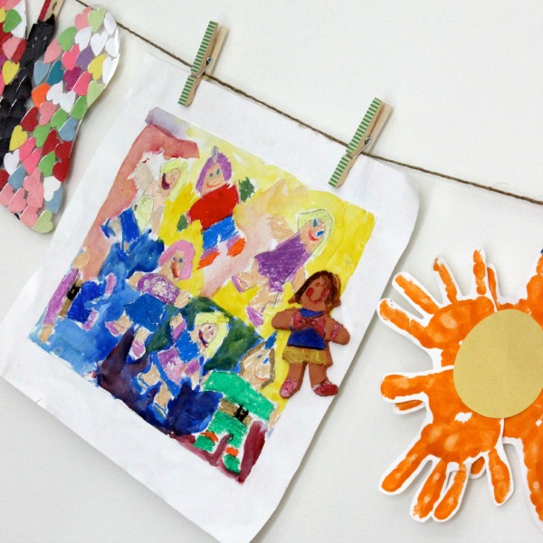 Displaying your child's artwork by clipping it on to twine or ribbon