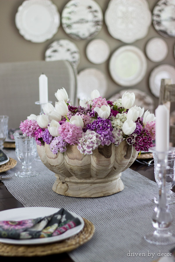 Colorful flowers in a decorative wood bowl for a simple centerpiece