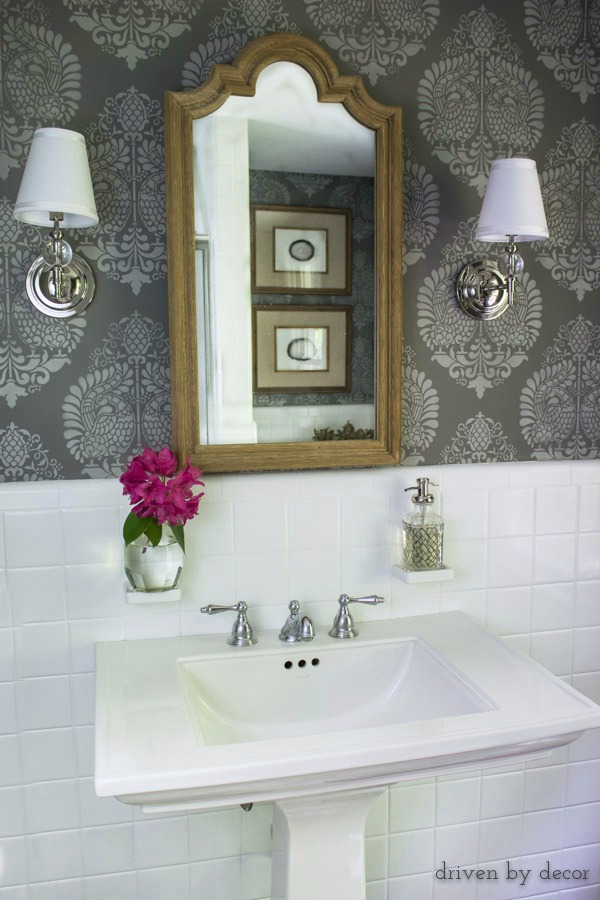 Powder room with stenciled walls and bud vase on built-in toothbrush holder!