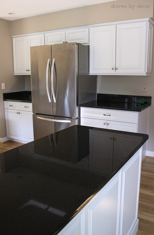 Beautiful remodeled kitchen with cabinet refacing, Black Pearl granite, and counterdepth refrigerator