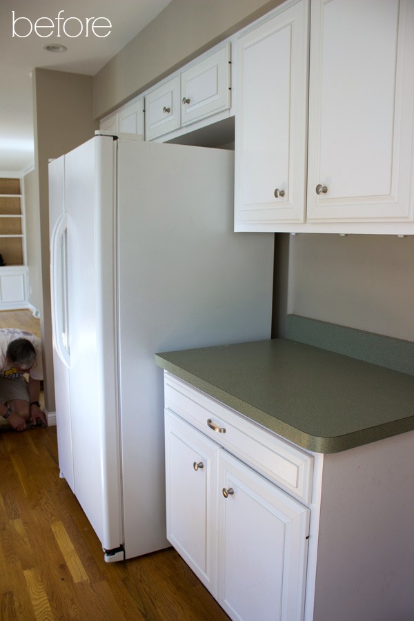 Cabinets and refrigerator before remodel