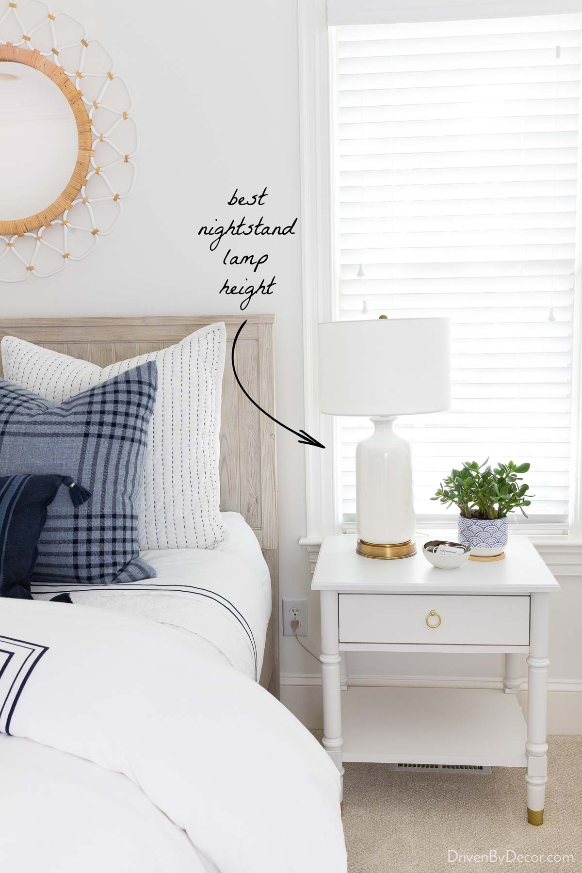 Showing the best nightstand lamp height with lamp next to bed