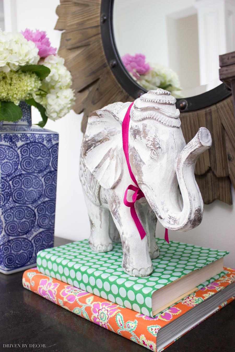 Love the idea of using fabric book covers in decorating!