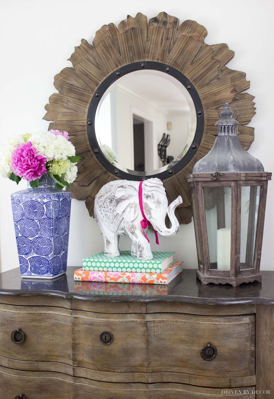 Stacked books with fabric book covers are a fun way to add color to your home decor!