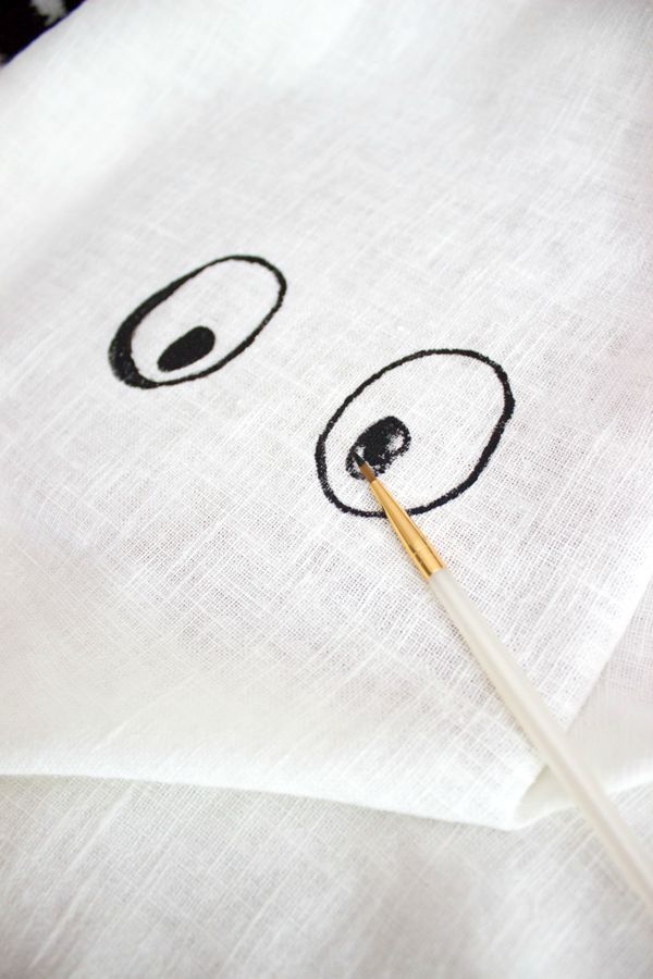 Paint eyes on pillow with craft paint