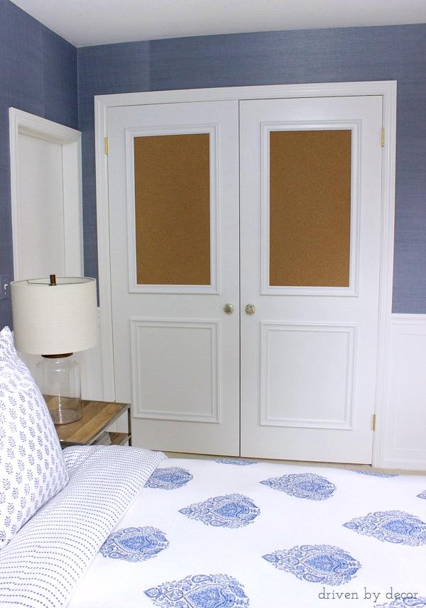 Flat closet doors framed out with panel molding including two cork boards - love for a kid's room!