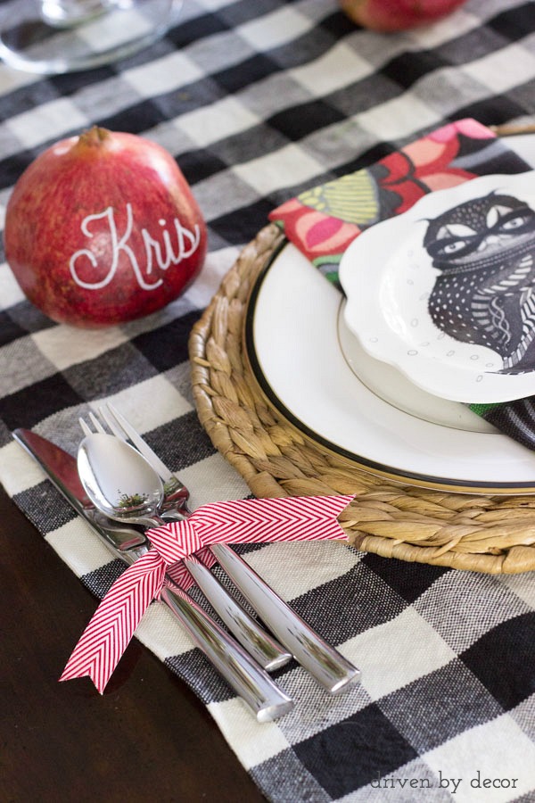 Names written on pomegranates with paint pens for unique placecards & silverware tied with ribbon - perfect for a holiday table!