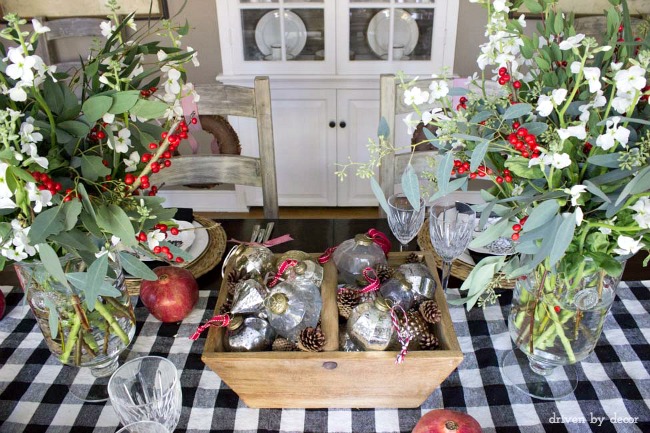 Vintage ornaments and pinecones as Christmas table centerpiece