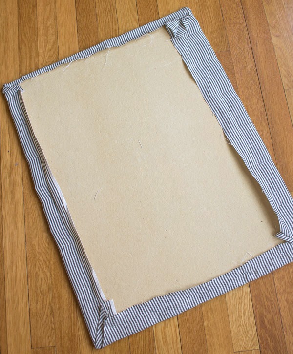 Step in making DIY fabric covered cork board