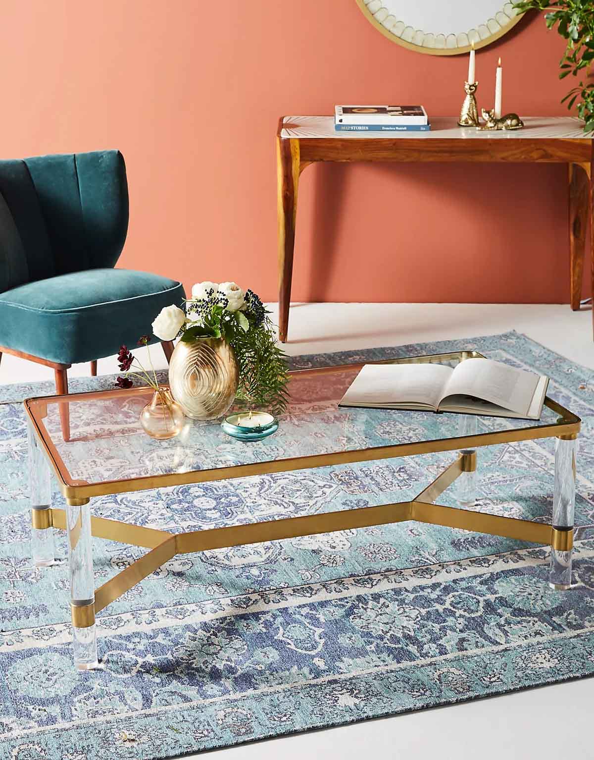 Acrylic coffee table with brass base