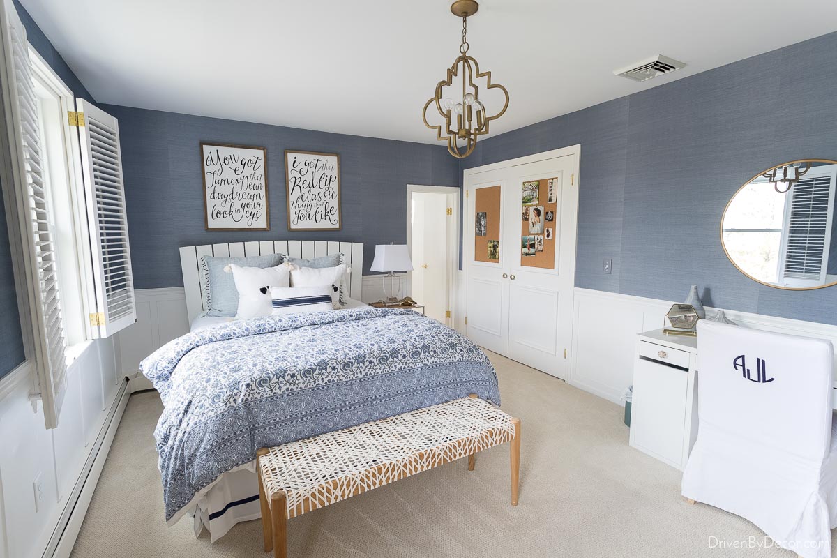 Blue grasscloth wallpaper in a bedroom