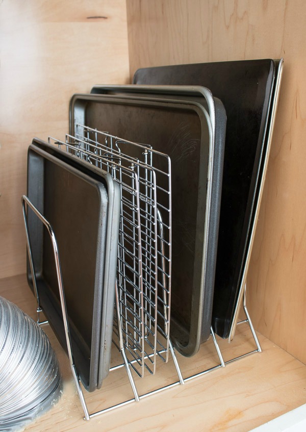 A simple metal rack keeps pans and cookie sheets neat and organized