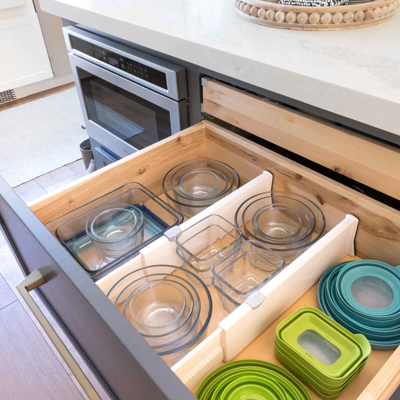 Such a great way to organize food storage containers! Love all of the ideas in this kitchen organization post!
