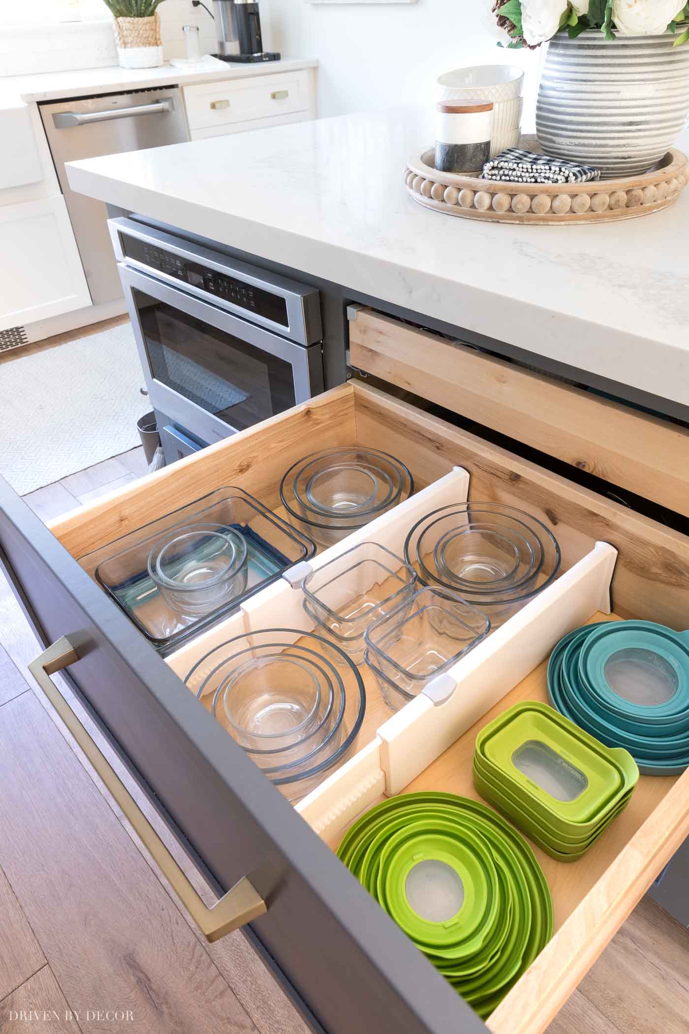 Such a great way to organize food storage containers! Love all of the ideas in this kitchen organization post!