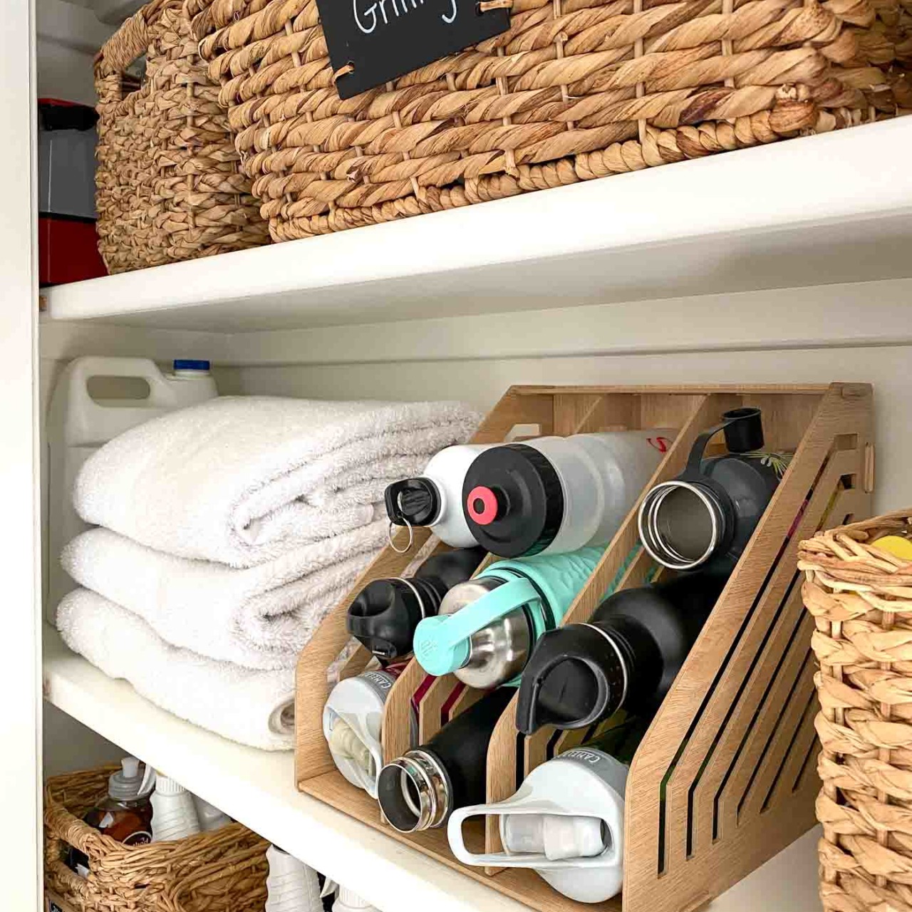 Love this kitchen organization idea for storing water bottles - so smart!