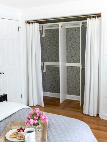 Closet transformed from a double door closet with center partition to one wide opening closed off with drapes - love!