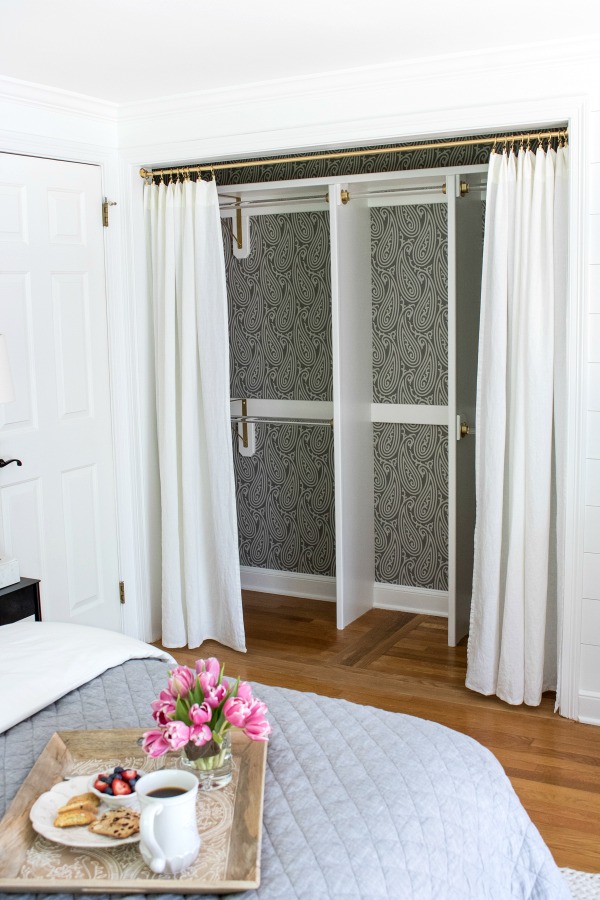 Closet transformed from a double door closet with center partition to one wide opening closed off with drapes love