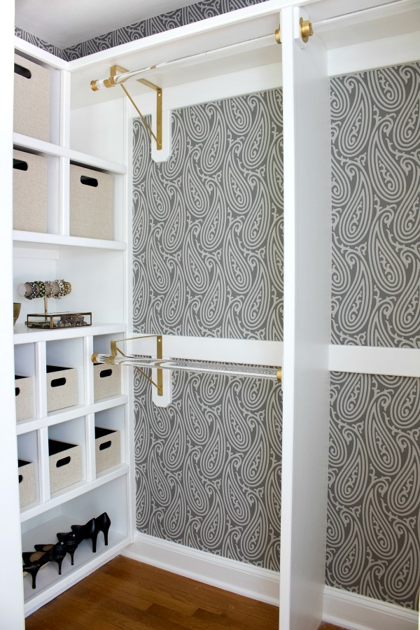 Gorgeous Farrow & Ball wallpaper and gold and acrylic rods are part of this fabulous closet makeover. Such a huge change from the "before"!