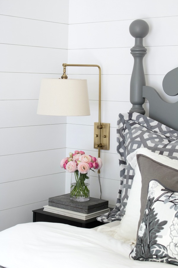 LOVE this swing arm sconce used in this master bedroom makeover - shade swings and pivots for easy reading in bed!