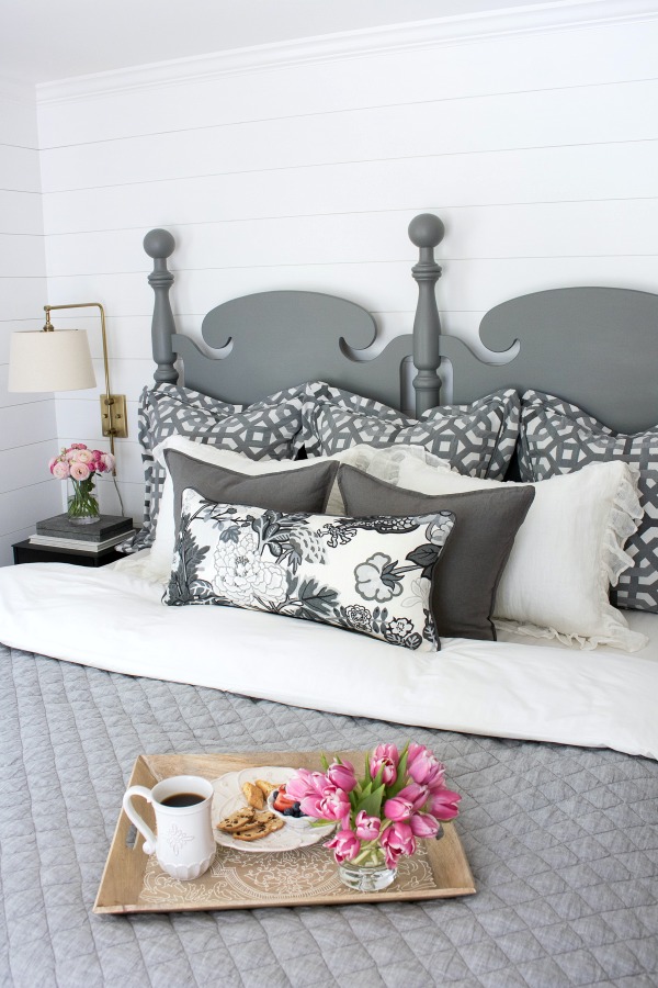 Layering of pillows on a king bed for the pillow lover - two euros, two standard shams, two square pillows, and a rectangular pillow