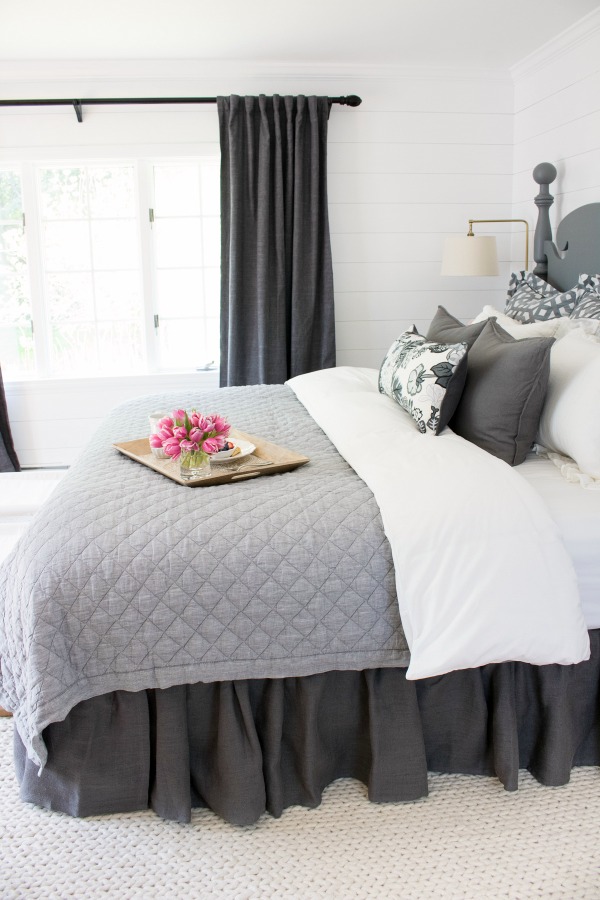 Love the ruffled bedskirt used in this master bedroom makeover